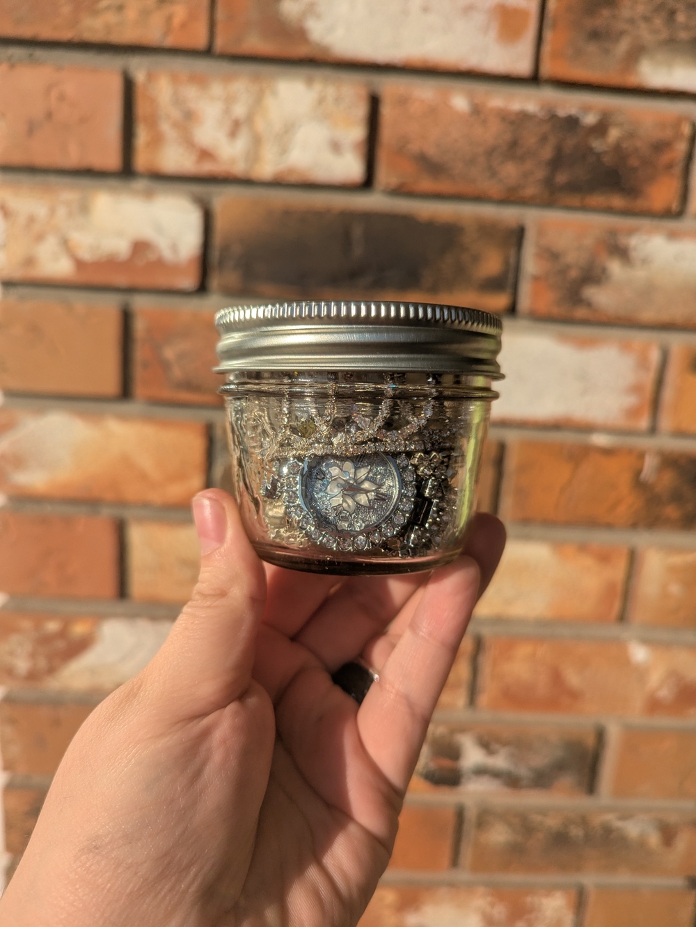Clear Jar Filled With Accessories